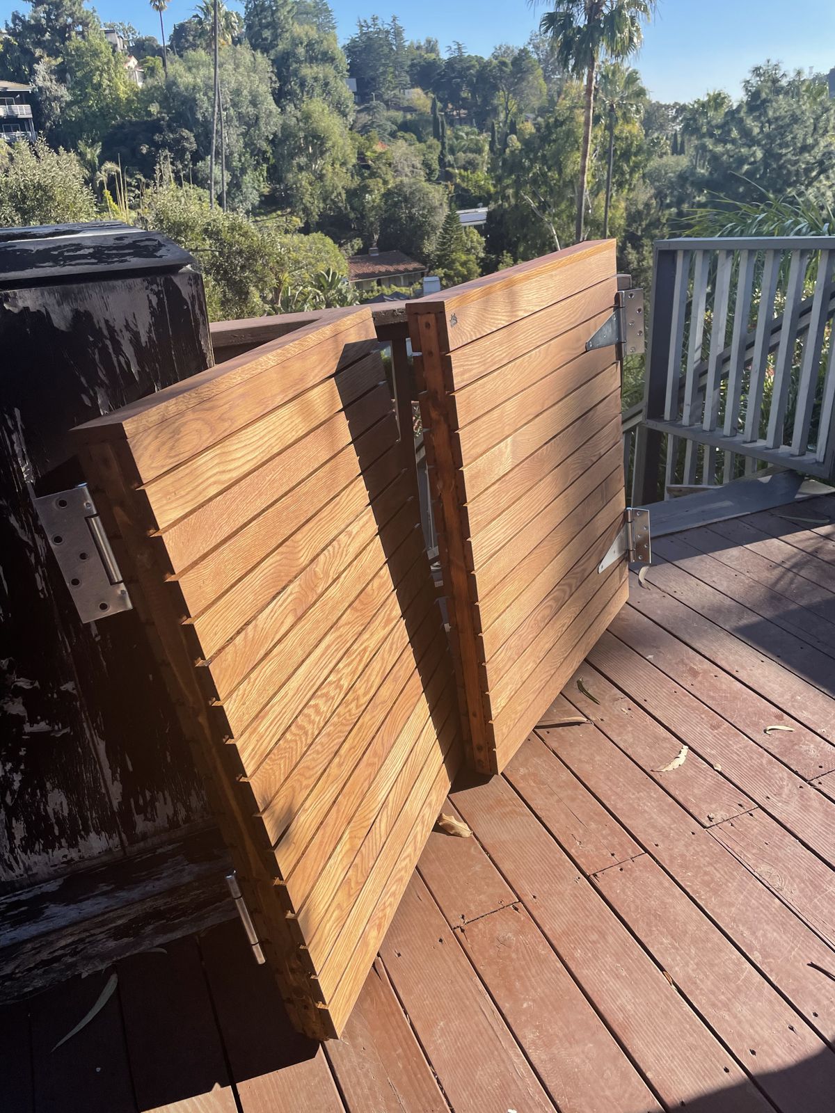 Pair of white oak screen panels standing open