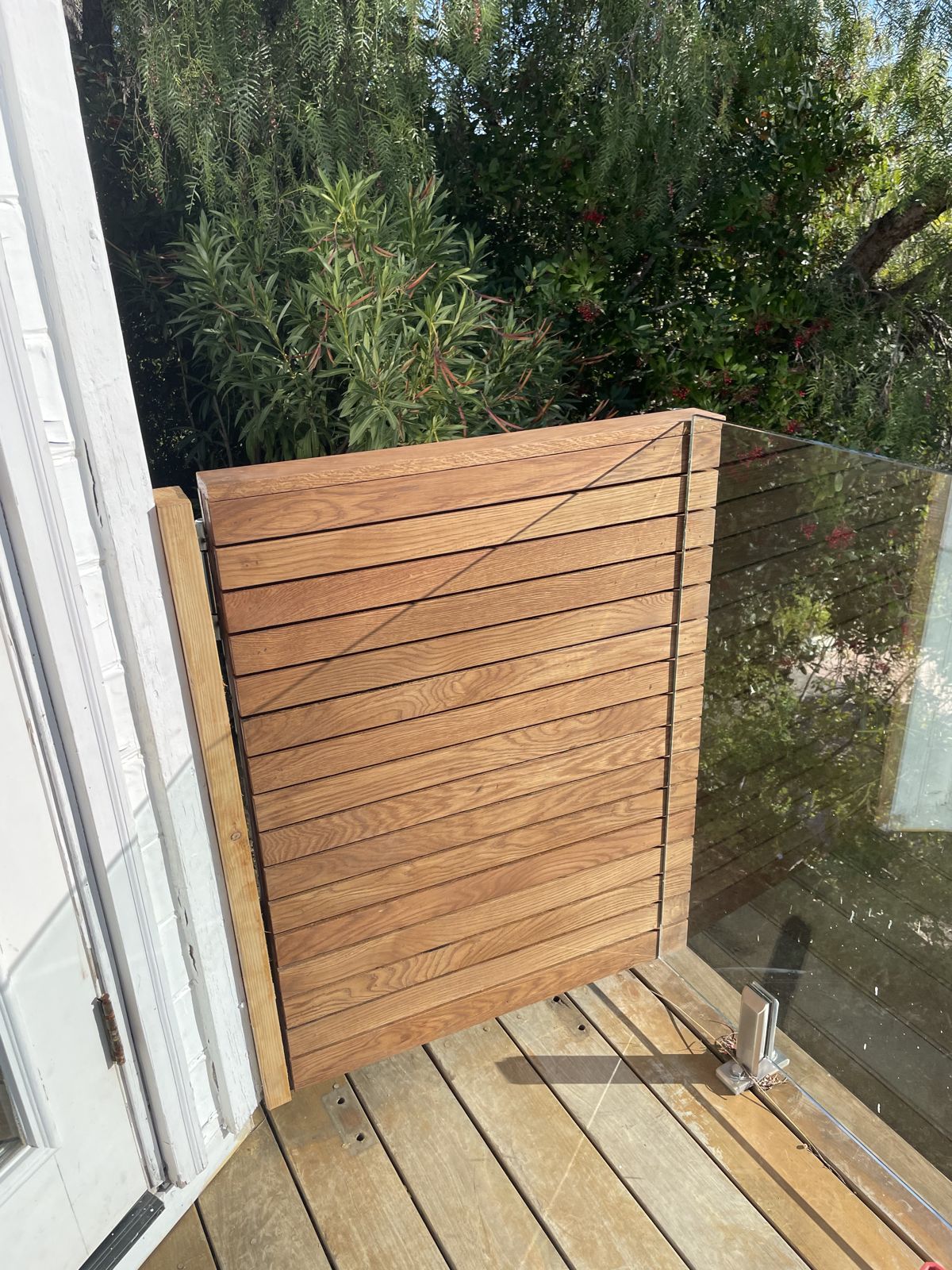 White oak screen closed against the wall