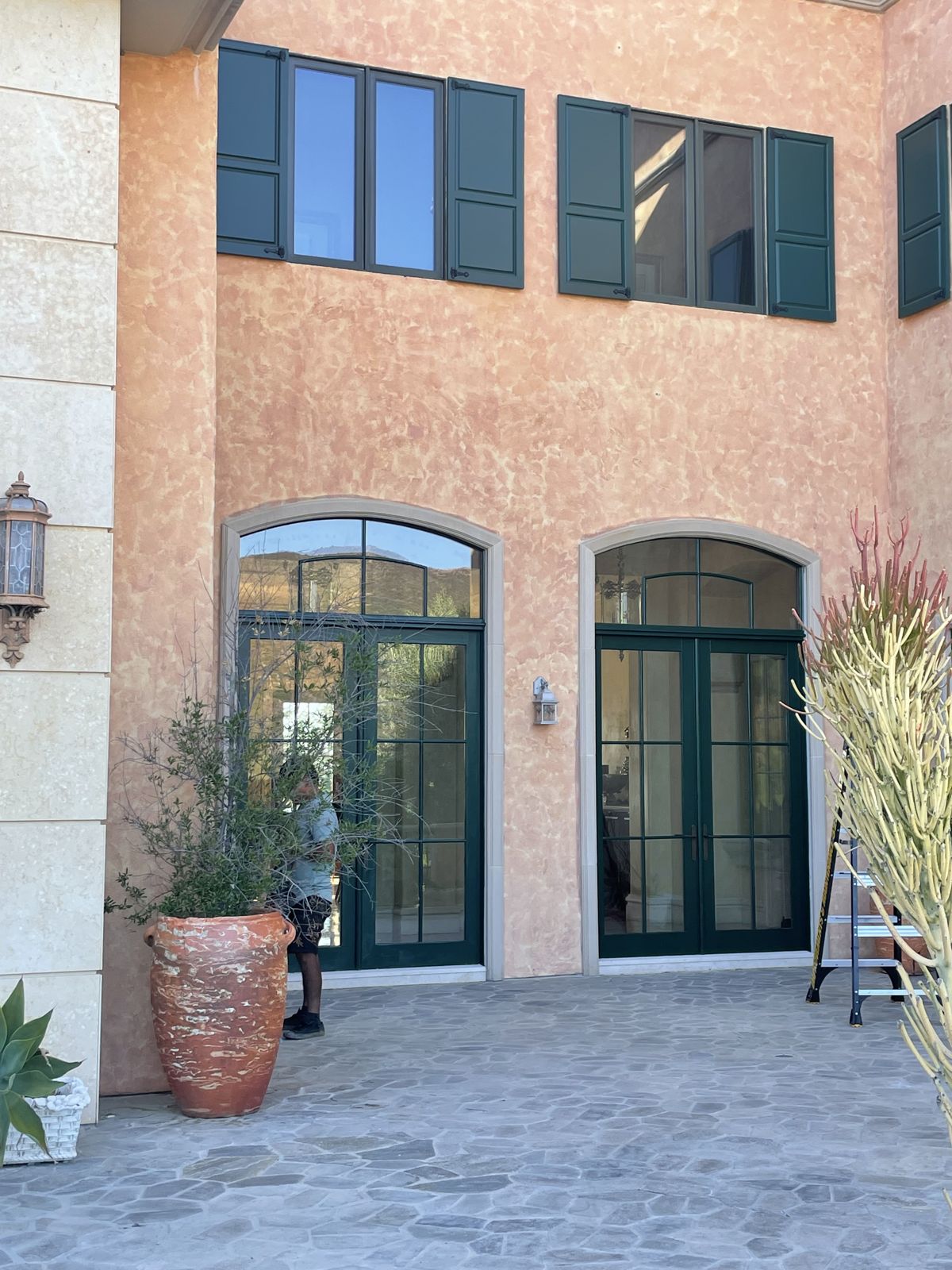 Arched entry openings masked off during refinishing