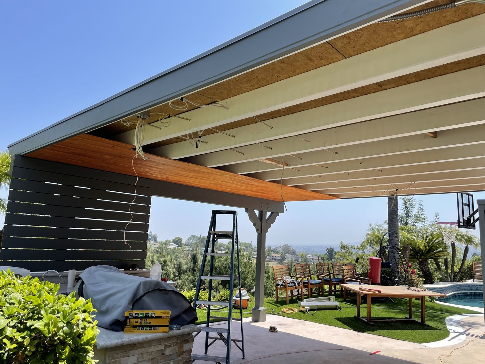 New patio cover structure framed and decked