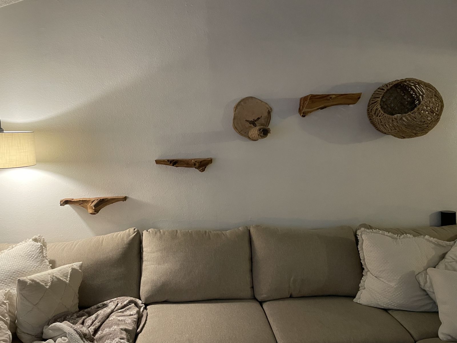 Live-edge floating shelves mounted on a living room wall